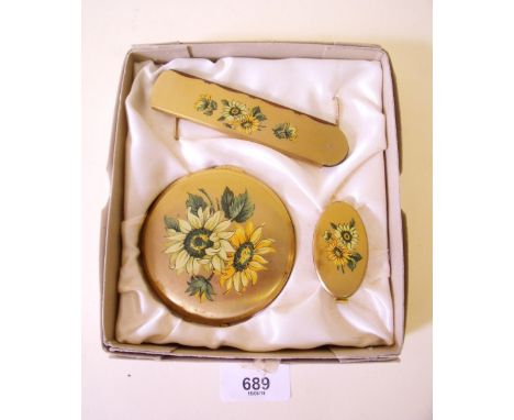 A Kigu compact, lipstick and comb set cased