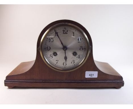 A 1930's arch top chiming mantel clock