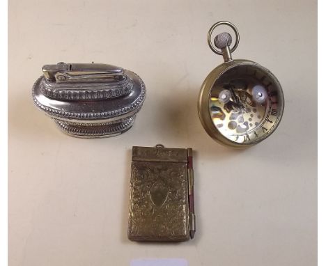 A glass ball clock, Edwardian notepad and a cigarette lighter