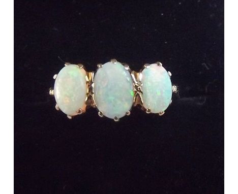 A 9 carat gold vintage three stone opal ring, size M