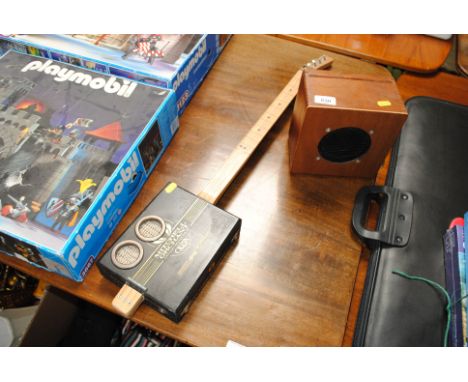 A cigar box guitar and speaker