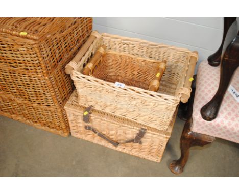 A wicker hamper and two wicker baskets