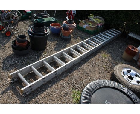 A large aluminium extending ladder measuring approx. 158" when closed