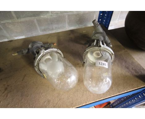 A pair of industrial style pendant light fittings 