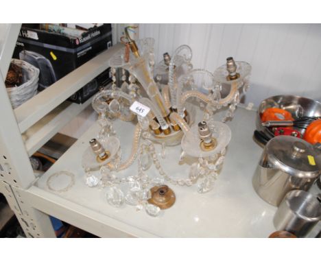 A glass five light chandelier with decorative prism drops 