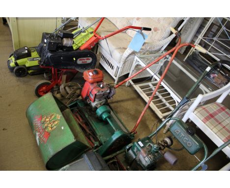 A Suffolk Super Punch dual drive petrol cylinder mower with rear roller