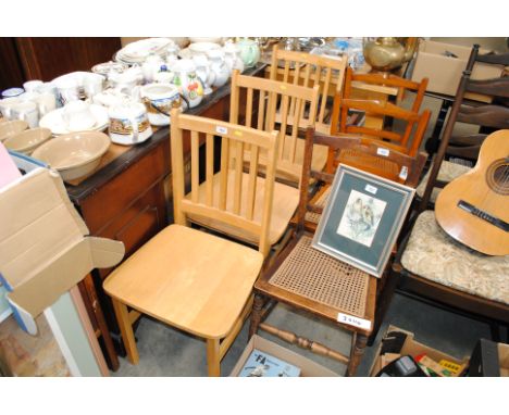 Three light wood slat back kitchen chairs