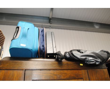 A briefcase, suitcase and various bags 