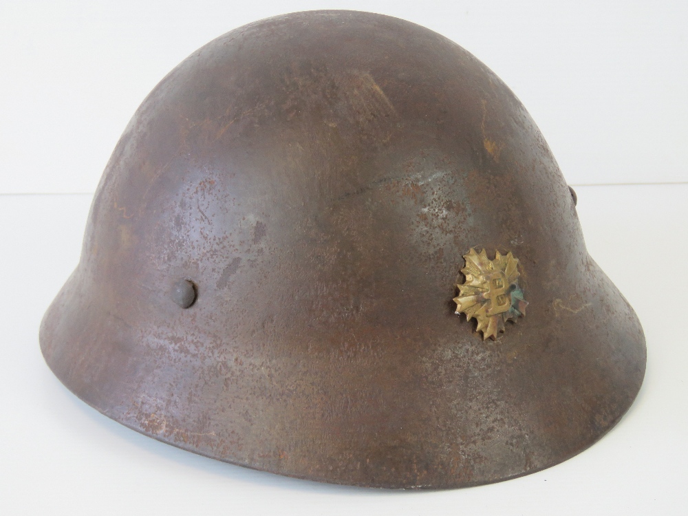A WWII Japanese Civil Defence helmet with painted name and detachment