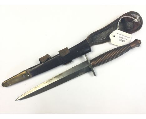 Early post war British Third Pattern Fairbairn-Sykes fighting knife. Plain double edged machine made blade 17cm long. Copper 