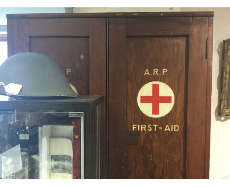 WW2 British Home Front ARP First Aid Cupboard. 92cm in width, 47cm in depth and 198cm in height. Some internal fittings prese