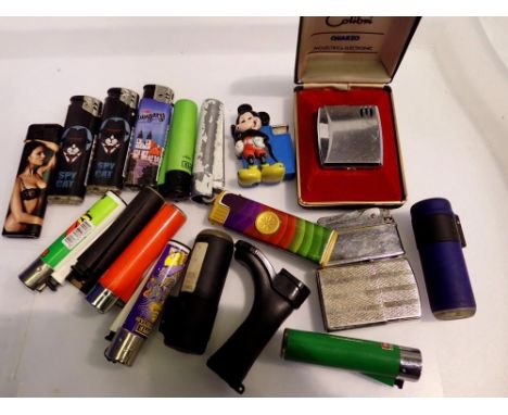 Quantity of cigarette lighters to include Ronson, Colibri Quarzo and a Mickey Mouse lighter. UK P&amp;P Group 1 (£16+VAT for 