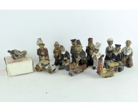 A collection of Tremar pottery figures, modelled as men in various occupations such as chimney sweep, chef, soldier, and othe