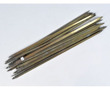 A quantity of early 20th century brass stair rods, the majority with the same finial design, length circa 84cm