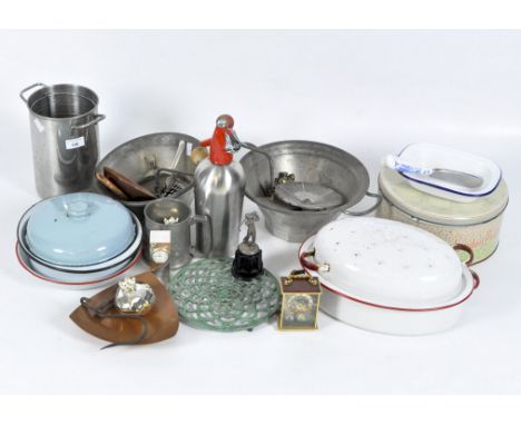 Assorted vintage and modern kitchen metalware and enamel items to include a sieve, dishes, trivet, soda syphon, and more