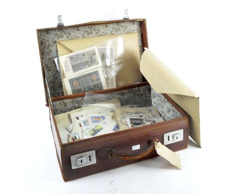 A collection of assorted ephemera, to include continental bank notes, cigarette cards and more, all in a breifcase