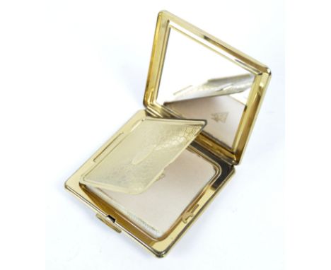 A gilt yellow metal and black enamel compact with marcasite set lid. 