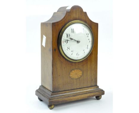 An early 20th century mahogany cased mantle clock with inlaid marquetry detailing, the enamel dial with Arabic numerals denot