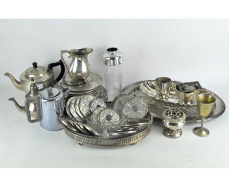 An extensive collection of vintage and modern silver plated ware to include teapots, jug, drinks and place mats, charger, and