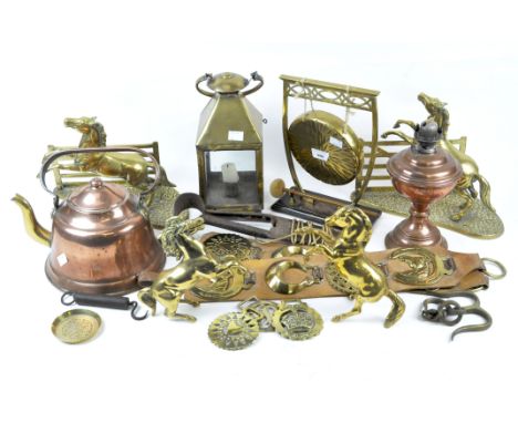 A collection of assorted brassware and other metalware, including a table gong on stand, hanging lantern, horse brasses and m