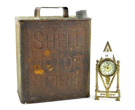 A 'Shell Motor Spirit' oil canister and a small gilt metal clock, height of oil canister 31cm, the clock with a pierced Neocl