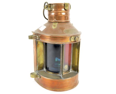 A Tung Woo of Hong Kong copper ship lantern, with an applied plaque stating 'Tri-colour Trawling Lantern', height 22cm