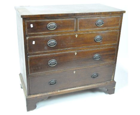 A 19th century mahogany chest of drawers in the George III style, two short drawers above three long graduated drawers, each 
