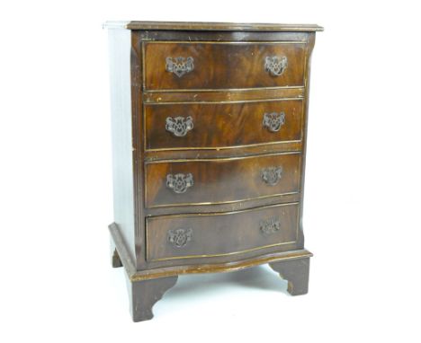 A small 20th century bow fronted chest of drawers with five drawers over bracket supports, 72cm x 48cm x 40cm