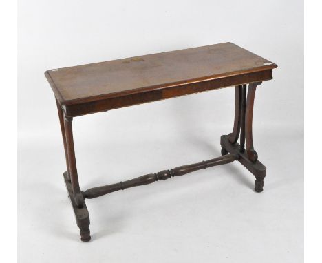 A Victorian mahogany console table of rectangular form, raised upon turned and flowing supports, 70cm x 99cm x 45cm