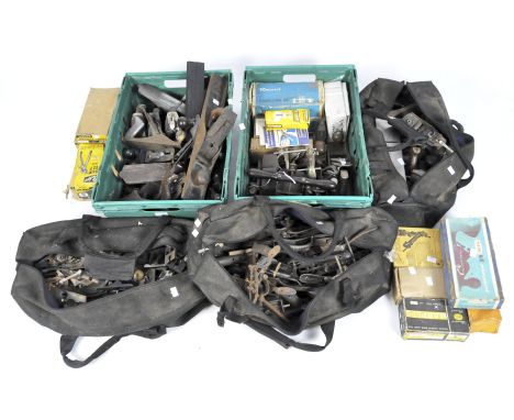 An extensive collection of vintage woodworking planes and related tools, some in original boxes, to include a Shamrock brand 