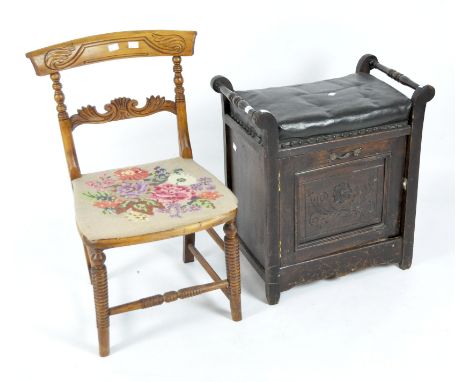 A piano stool and a low chair, the first with turned handles and black canvas upholstery above a cupboard with carved door, h