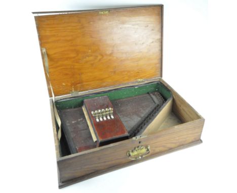 Muller's Orpheus Auto-Harp with 33 strings and eleven key buttons, length circa 56cm, in a fitted wooden box