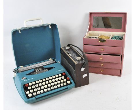 A vintage Roberts radio, together with a cased typewriter and a pink leatherette jewellery box