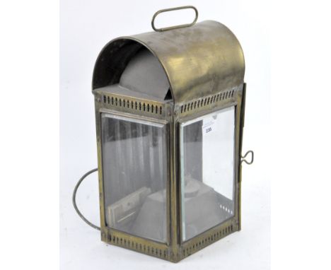 An antique brass lamp modified into an electric light, the domed structure with pierced decoration, a handle to the top and g