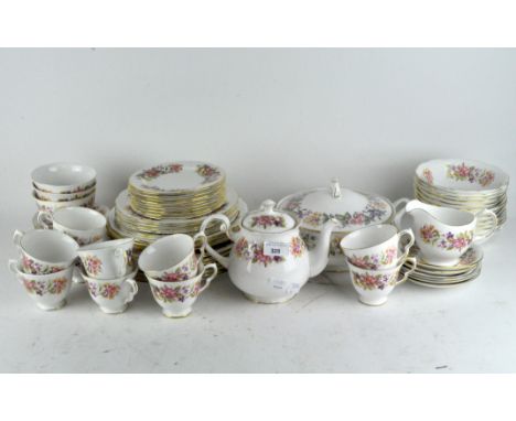 A part Colclough tea and dinner service comprising cups and saucers, various plates, bowls, teapot, and more, together with a