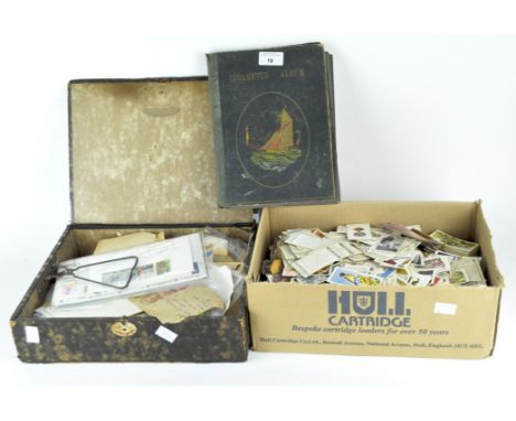 A collection of stamps and cigarette cards, the designs featuring national flags, animals and historical figures, some contai