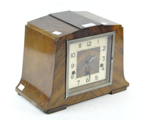 An Art Deco mahogany veneered mantle clock by Norland, the square dial with Arabic numerals denoting hours, 24.5cm high