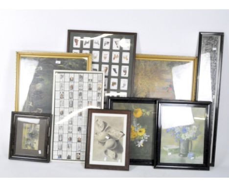 A collection of prints and photographs, depicting still life, country scenes and schools, together with a selection of cigare