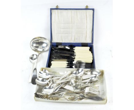 A selection of flatware, including a boxed set of stainless steel knives and forks, an EPNS ladle, napkin rings and teaspoons