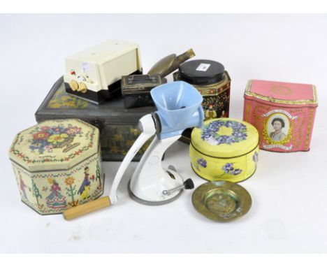 Assorted vintage tins and other collectables, including a Rhythm no 16506 flip clock