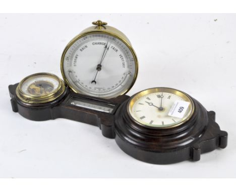 Two 20th century barometers, both of circular form, one with a brass frame, diameter 12cm, the other in a wooden banjo frame 