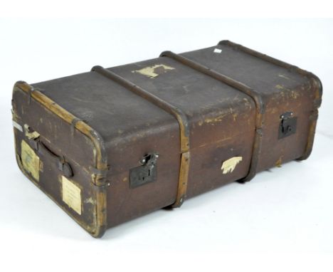 An early 20th century canvas travel trunk with wooden banding, 34cm x 93cm x 54cm