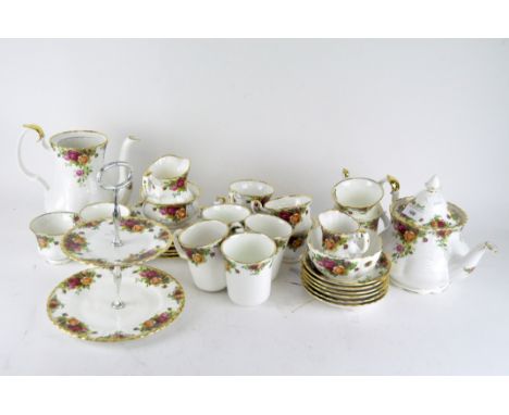 A Royal Albert Old Country Roses tea and coffee service, comprising cups and saucers, mugs, milk jugs, sugar bowls, small pla