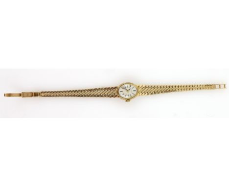 Gold Tissot watch, with oval dial and baton markers, on gold bracelet strap, marked 9 ct .    Gross weight 24 grams 