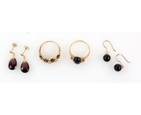 Garnet and diamond dress ring, a pair of faceted tear drop garnet earrings, ruby and onyx ring,  and a pair of black quartz e