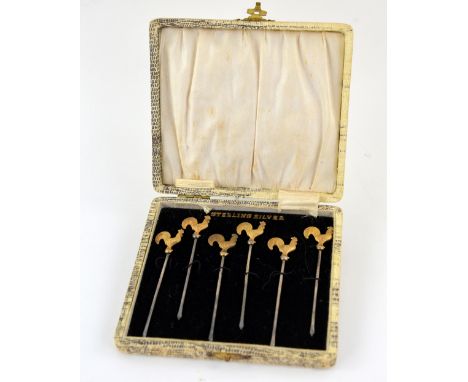 Cased set of six sterling silver gilt cockerel finial cocktail sticks .    