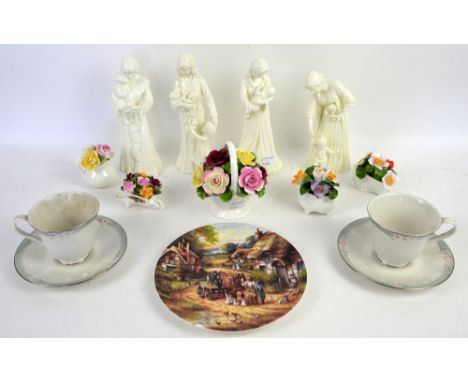 Four Royal Worcester figures; 'Once upon a Time', 'Sweet Dreams', 'First Steps' and 'New Arrival', a Royal Doulton 'Sophistic