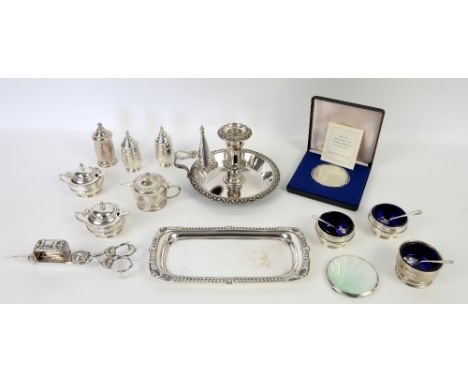 Two silver table cruets, a silver plated chamber stick, a candle snuffer with tray, commemorative silver coin and a compact..