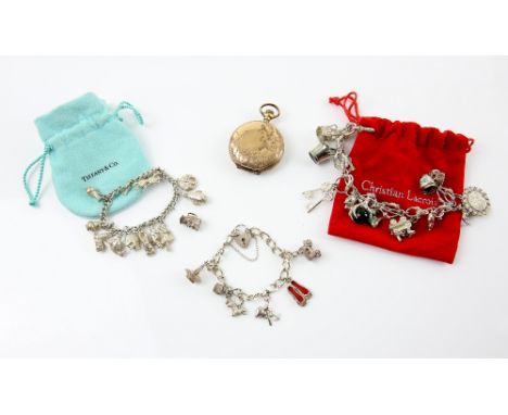 Mixed group of items, three silver charm bracelets, each with several charms, including steam engine, elephant and crown and 