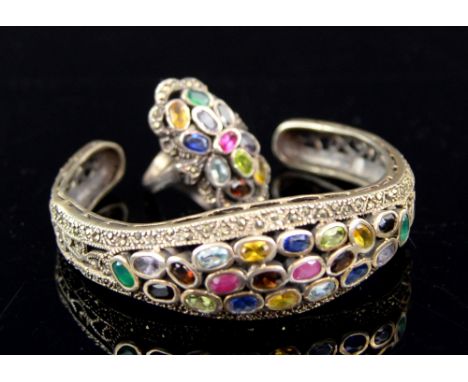 Silver and multi gem set bangle and ring  .     All stones are present bracelet,  split on edge of side 